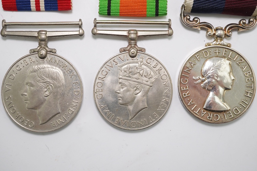 A group of assorted medals; WW2/ERII Cadet Forces medal group of 3 with two clasps to Fg.Off.W.K.Winstone R.A.F.V.R.(T); ERII RAFLSGC to Cpl B.K.Stockwell (F2570477) in box; WW2 Dm & WM. Condition - fair to good.